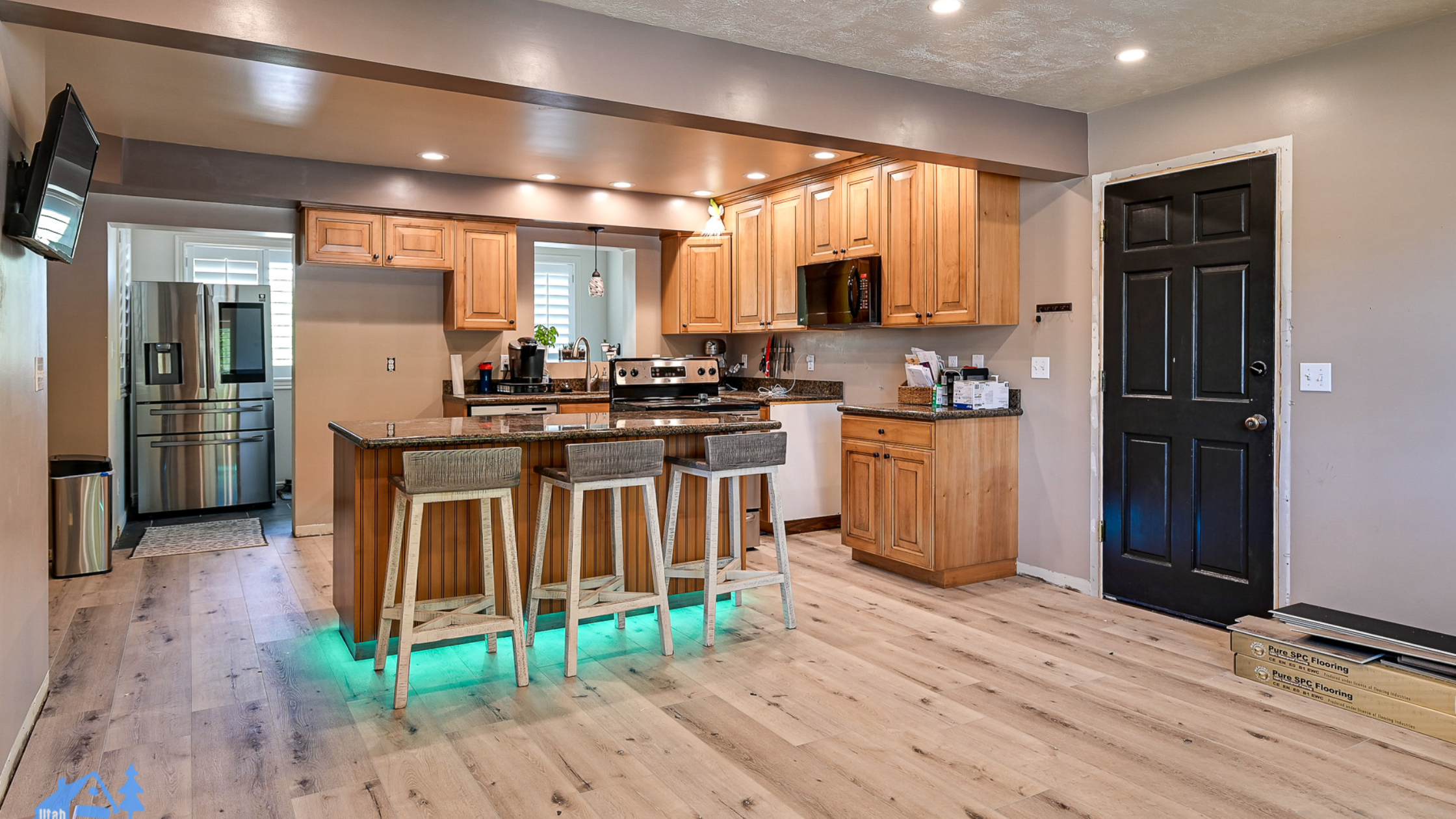 When PBS launched This Old House in 1979, it was one of the first home renovation shows available on TV. Over the next forty-five years, viewers have had more than a hundred different home improvement shows to choose from, including Dream Home Makeover, Kitchen Glow Up, Mountain Remodel, and Rescue My Renovation. Perhaps you’ve watched some home renovation shows and thought of some changes you’d like to see around your own home. Do you try tackling it yourself? Probably not if you’ve been watching Help! I Wrecked My House. So who should you hire? A home remodeling contractor? A home renovation professional? Does renovate mean the same thing as remodel? Is an expert in one automatically an expert in the other? Renovating and remodeling do have unique meanings. Here’s what you need to know about each one. Renovating Definition: Renovating is about updating, improving, or modifying a space without making major structural changes. Scope: Renovation typically involves projects such as repainting walls, replacing cabinets, updating fixtures, refinishing floors, or upgrading appliances. Goal: The goal of a renovation is to improve the comfort, usability, or style of a home without altering the existing layout. Example: Below are before and after photos of a kitchen renovation Utah Home Remodel Experts completed in Sandy, UT. The layout of the room is unchanged, but we repainted the door and cabinetry, changed the look of the walls and kitchen island with a faux brick design, replaced the original countertops with ones imported from Europe, and added pendant light fixtures over the island. Remodeling Definition: Remodeling involves changing the structure or layout of a space, often with a significant redesign. Scope: Remodeling projects are usually larger and more complex, as they can involve moving walls, adding windows, changing room configurations, or building entirely new spaces. Goal: The goal of a remodel is to transform a space to serve a new function or aesthetic. Example: Below are before and after photos of a kitchen remodel Utah Home Remodel Experts completed in Holladay, UT. The extensive changes included removing walls to open up the kitchen to the rest of the main level, reflooring the now unified space, major electrical upgrades and plumbing reroutes to move the location of the sink and add a kitchen island with pendant lights and built-in appliances, and completing the new chic aesthetic with white quartz countertops and shaker-style cabinets with brushed gold finishes. The Most Important Thing To Remember Renovating is making something old feel new while remodeling is transforming something old into something new. But while there is technically a difference between the two terms, in reality, they are used interchangeably among the home improvement community. So it doesn’t matter whether you call us your glow-up gurus, makeover masters, renovation specialists, or remodeling experts–all that matters is that you call us. Because at Utah Home Remodel Experts, we don't care what terms you use; we only care about bringing your vision for your living space to life.