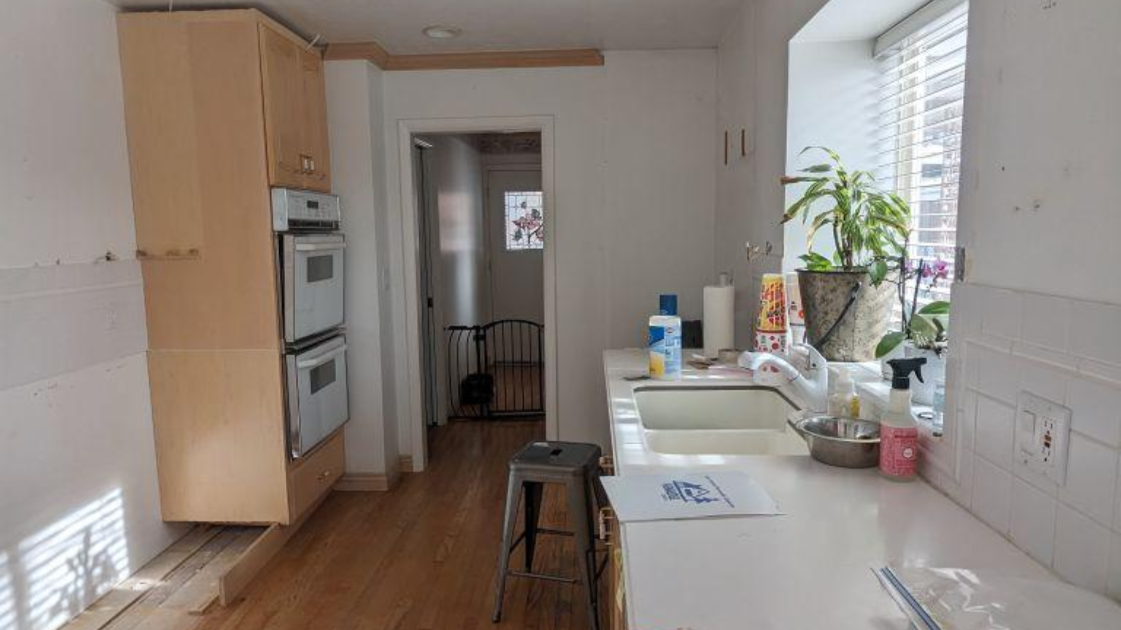 When PBS launched This Old House in 1979, it was one of the first home renovation shows available on TV. Over the next forty-five years, viewers have had more than a hundred different home improvement shows to choose from, including Dream Home Makeover, Kitchen Glow Up, Mountain Remodel, and Rescue My Renovation. Perhaps you’ve watched some home renovation shows and thought of some changes you’d like to see around your own home. Do you try tackling it yourself? Probably not if you’ve been watching Help! I Wrecked My House. So who should you hire? A home remodeling contractor? A home renovation professional? Does renovate mean the same thing as remodel? Is an expert in one automatically an expert in the other? Renovating and remodeling do have unique meanings. Here’s what you need to know about each one. Renovating Definition: Renovating is about updating, improving, or modifying a space without making major structural changes. Scope: Renovation typically involves projects such as repainting walls, replacing cabinets, updating fixtures, refinishing floors, or upgrading appliances. Goal: The goal of a renovation is to improve the comfort, usability, or style of a home without altering the existing layout. Example: Below are before and after photos of a kitchen renovation Utah Home Remodel Experts completed in Sandy, UT. The layout of the room is unchanged, but we repainted the door and cabinetry, changed the look of the walls and kitchen island with a faux brick design, replaced the original countertops with ones imported from Europe, and added pendant light fixtures over the island. Remodeling Definition: Remodeling involves changing the structure or layout of a space, often with a significant redesign. Scope: Remodeling projects are usually larger and more complex, as they can involve moving walls, adding windows, changing room configurations, or building entirely new spaces. Goal: The goal of a remodel is to transform a space to serve a new function or aesthetic. Example: Below are before and after photos of a kitchen remodel Utah Home Remodel Experts completed in Holladay, UT. The extensive changes included removing walls to open up the kitchen to the rest of the main level, reflooring the now unified space, major electrical upgrades and plumbing reroutes to move the location of the sink and add a kitchen island with pendant lights and built-in appliances, and completing the new chic aesthetic with white quartz countertops and shaker-style cabinets with brushed gold finishes. The Most Important Thing To Remember Renovating is making something old feel new while remodeling is transforming something old into something new. But while there is technically a difference between the two terms, in reality, they are used interchangeably among the home improvement community. So it doesn’t matter whether you call us your glow-up gurus, makeover masters, renovation specialists, or remodeling experts–all that matters is that you call us. Because at Utah Home Remodel Experts, we don't care what terms you use; we only care about bringing your vision for your living space to life.