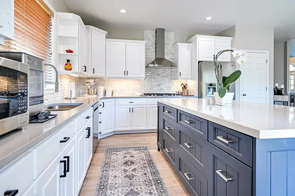 Large modern kitchen with two tone cupboards, dark blue and white