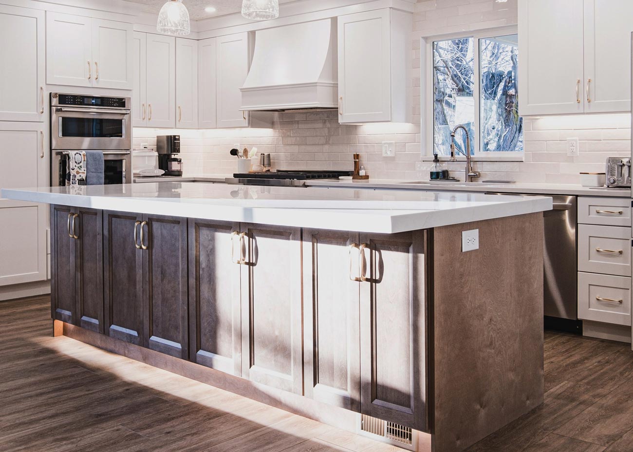 Beautiful kitchen remodel featuring two-tone cabinets, natural wood, pendant lights, part of a kitchen remodel project in Salt Lake City Utah, by Utah Home Remodel Experts