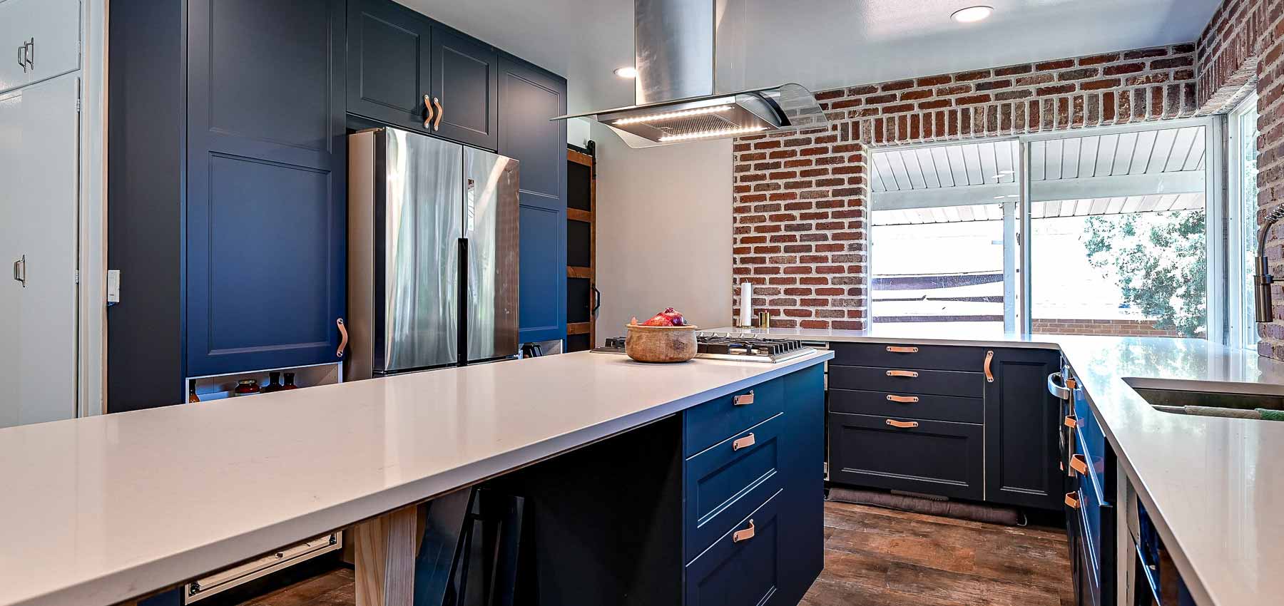 Blue cabinets in a kitchen remodel by Utah Home Remodel Experts